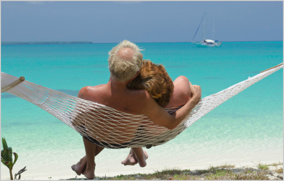retired couple on beach image